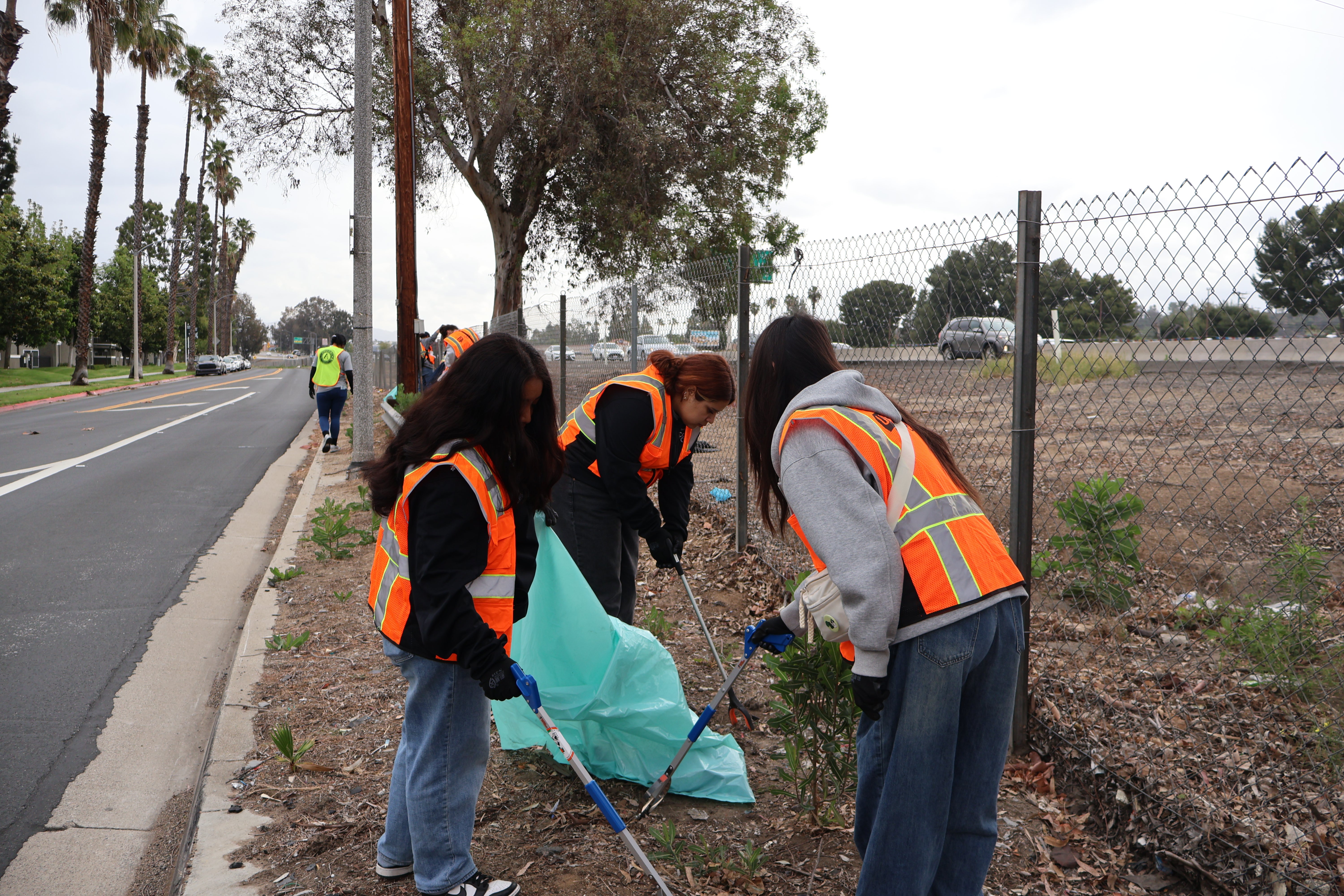 People cleaning street