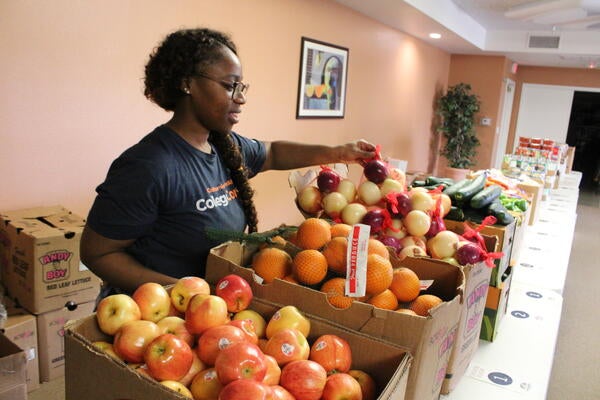 woman serving fruit