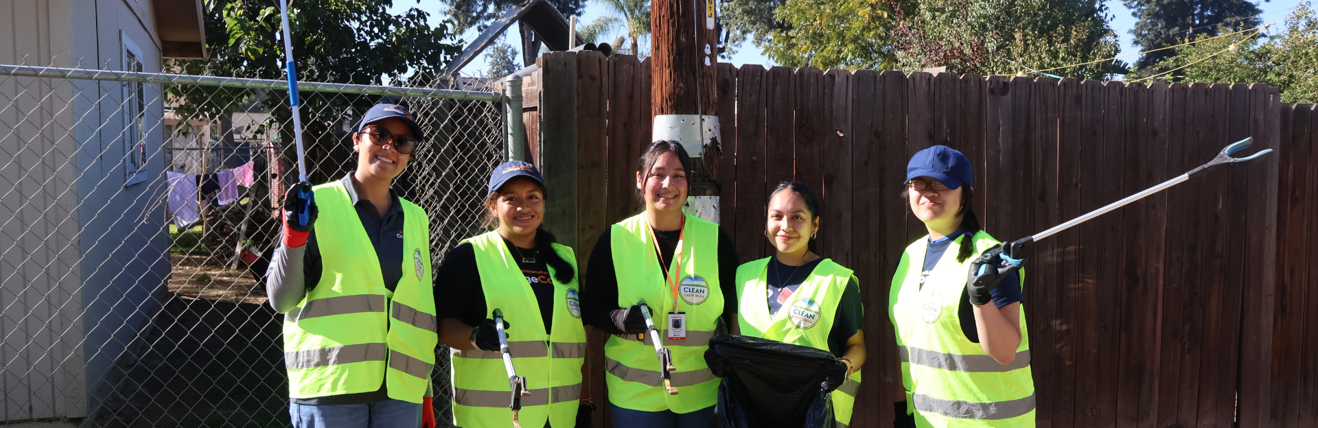 Group of students at a community-clean up. 